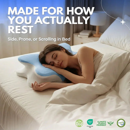 Woman sleeping peacefully on bed using ergonomic blue and white pillow designed for side, prone, or scrolling in bed
